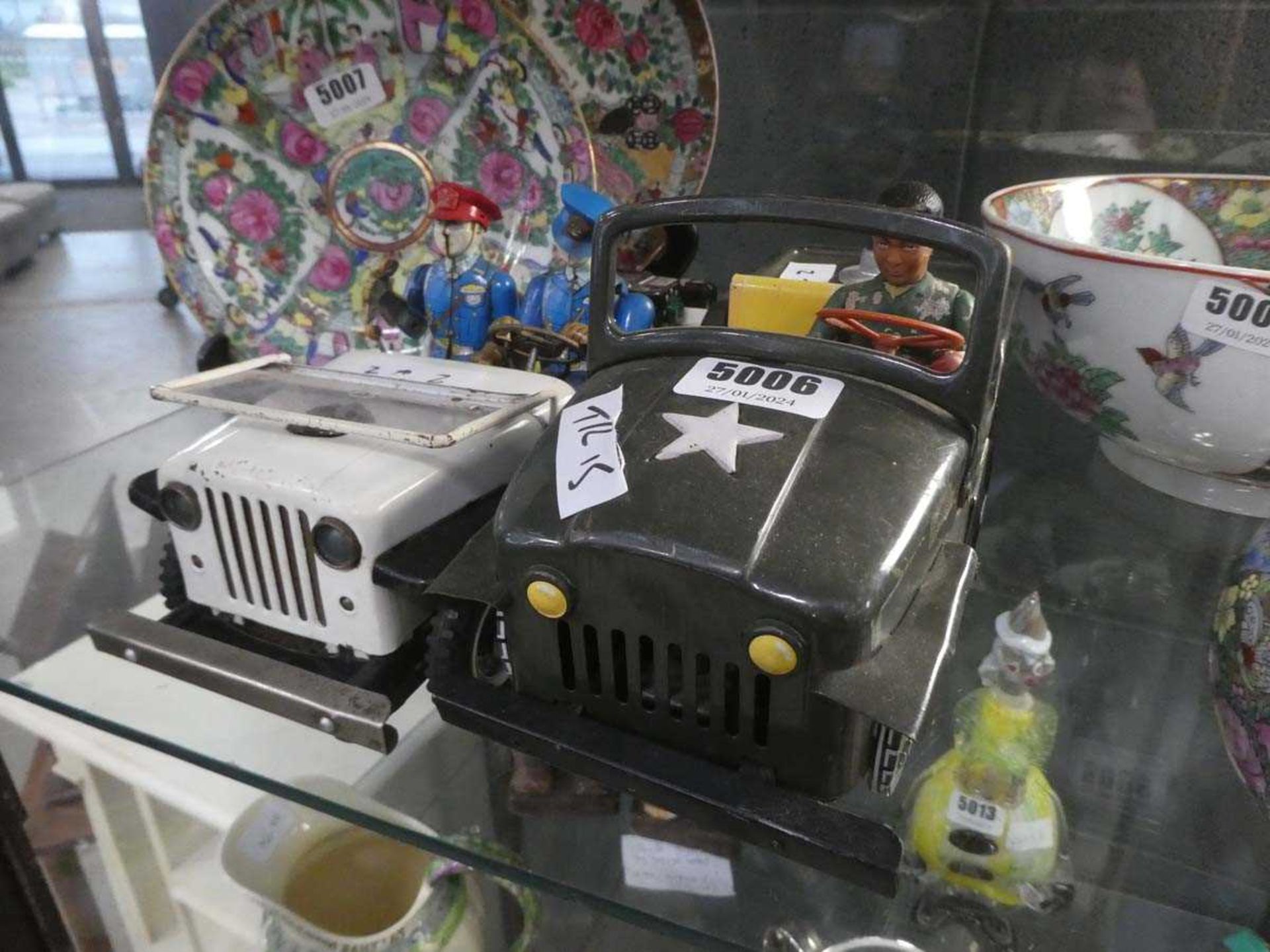 Two military tin plate cars