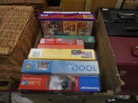 Box containing jigsaw puzzles