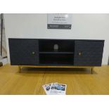 Modern entertainment unit with central drawers and cupboards to the side