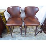 Modern pair of brown leatherette upholstered bar stools with brass studded detail