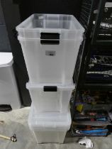 +VAT Stack of clear plastic storage boxes