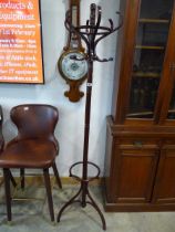 Free standing brown hat and coat stand