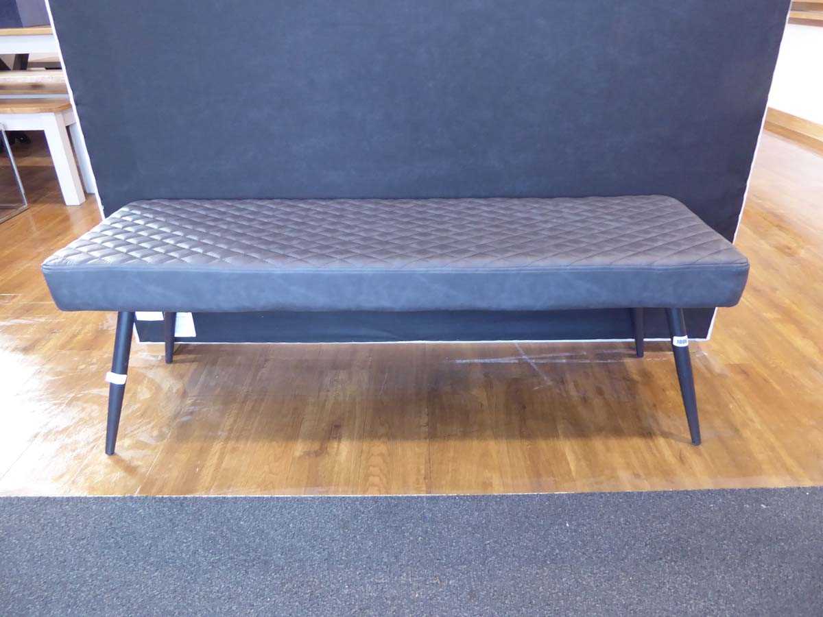 Modern black cushioned leatherette upholstered bench seat on black tapered supports