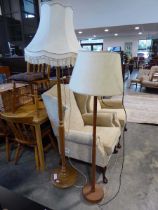 2 standard lamps, 1 in teak, both with natural coloured shades