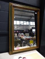Green and gilt framed and beveled rectangular wall mirror
