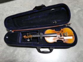 Child sized violin with bow in blue carry case