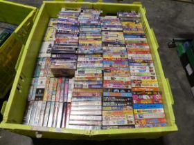 Shallow pallet containing 2 layers of cased VHS films incl. large quantity of comic titles with