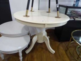 Cream coloured single pedestal circular extending dining table