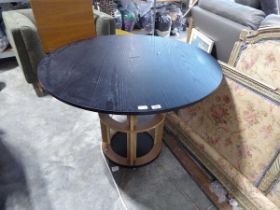 Black ash finish circular dining table on open wooden single pedestal base