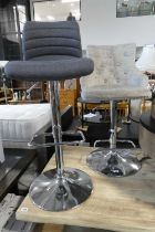 Modern grey upholstered button back stool on adjustable chrome base, together with a grey fabric and