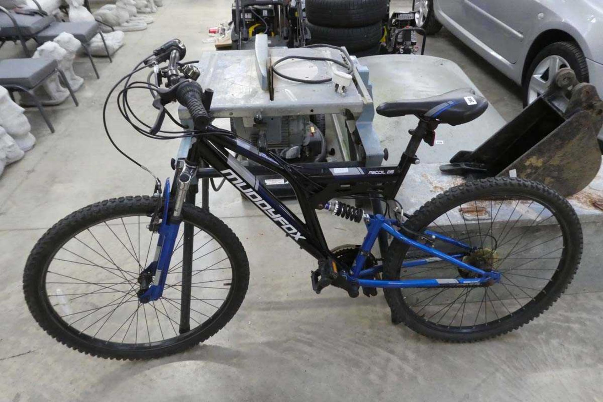 Muddyfox Recoil 26 mountain bike in black and blue