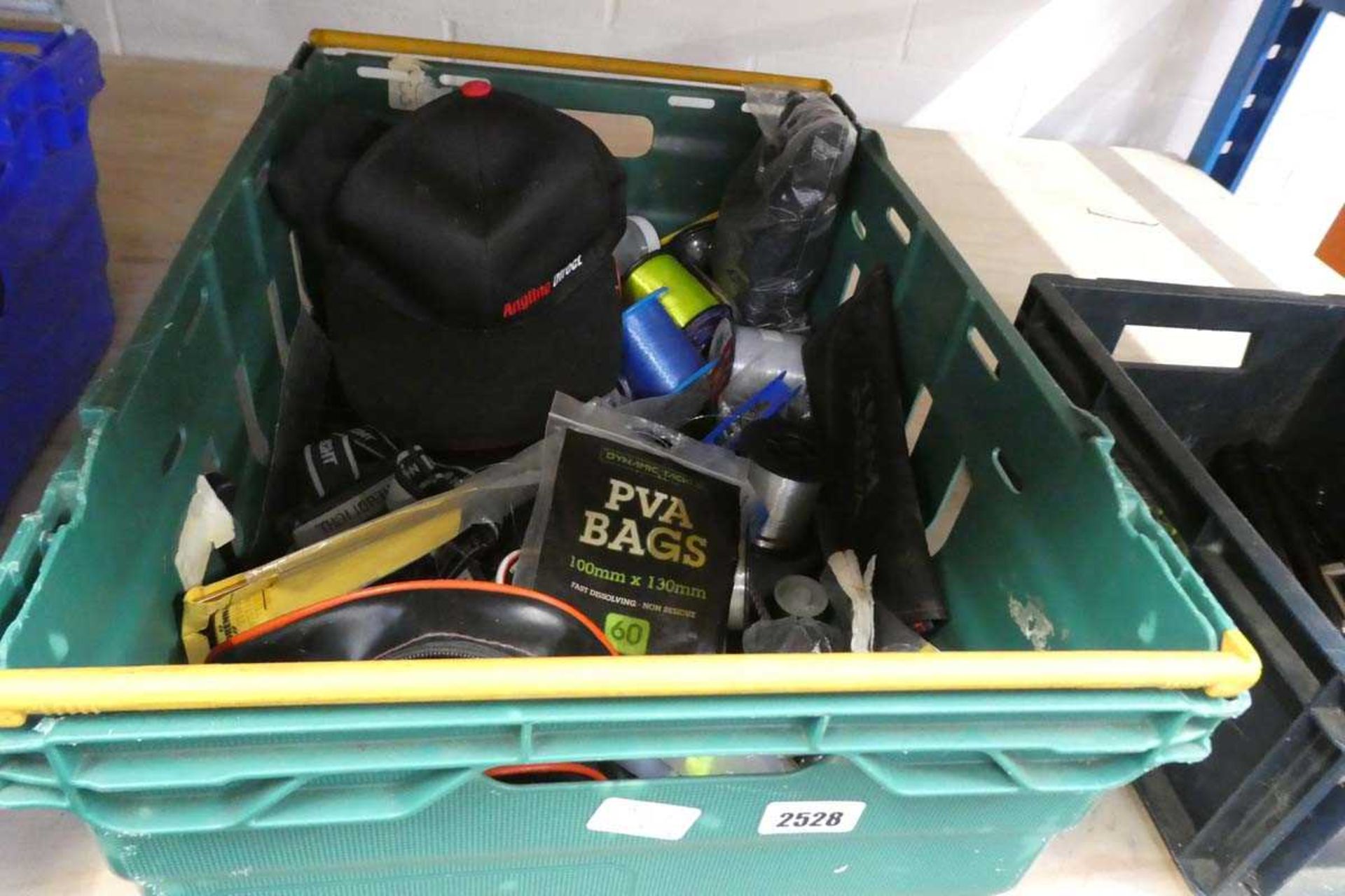 Crate containing mixed lot of spools, lines and tackle