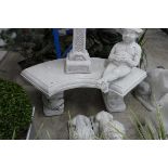 Concrete semicircular bench with fighting fish bench ends