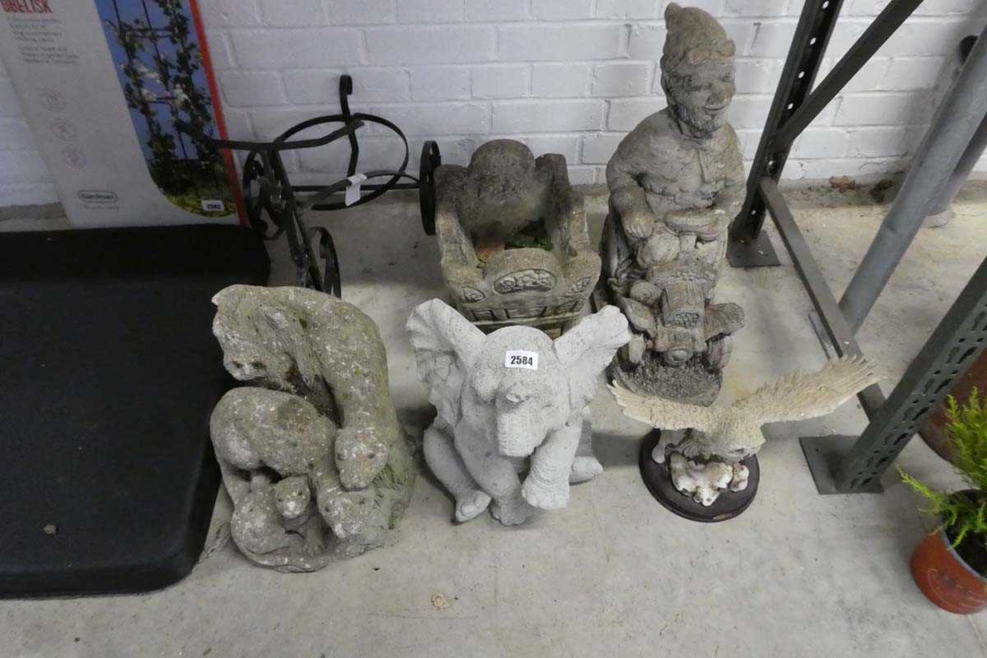 Collection of various concrete ornaments incl. metal trike planter