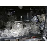 Cage containing various crystal and cut glass