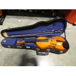 Violin and bow housed in a Skylask carry case