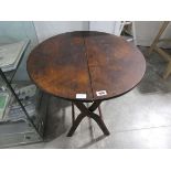 Circular folding brown occasional table