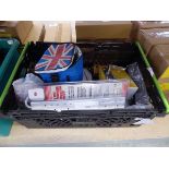 Black crate containing various items incl. plastic forks, door handles, large torch, Yale door lock,