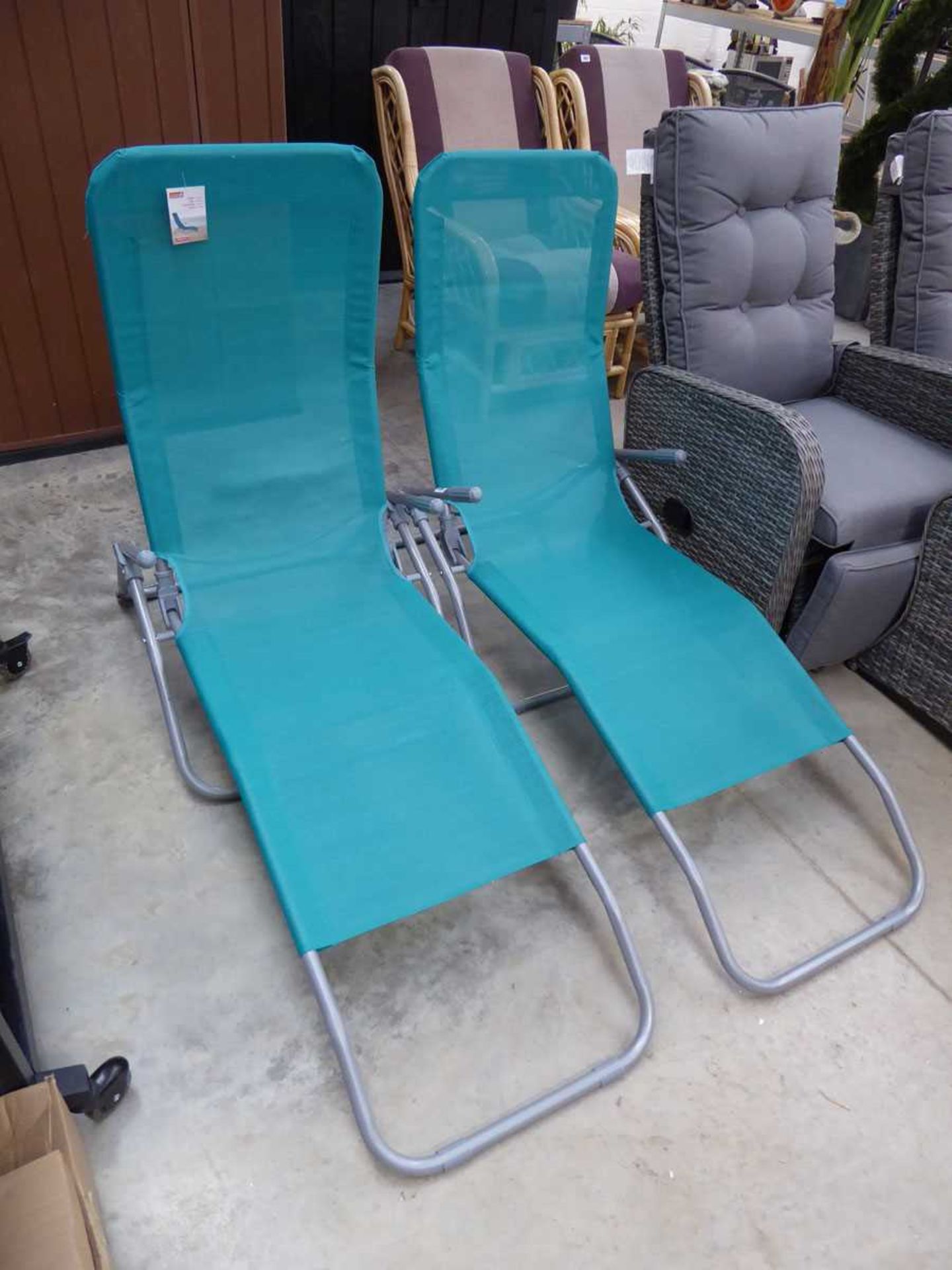 Pair of aqua blue garden sunloungers