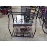 +VAT Boxed rear bike carrier, together with a 3 sectioned bike stand with storage basket above