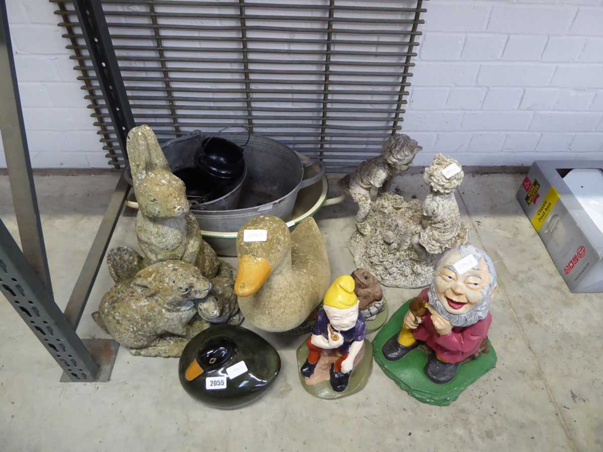 Quantity of outdoor concrete items, to include pair of rabbits, ducks, boy and girl on seesaw,