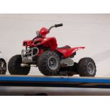 Child's battery operated 4-wheeled quad bike with charger