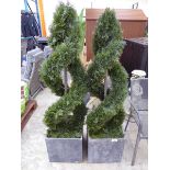 +VAT Pair of artificial spiral shaped conifers in grey slated pots (please note shrub on left is not