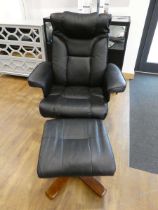 Modern black leatherette upholstered swivel easy chair with matching foot stool