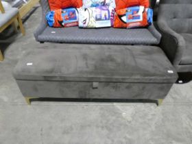 Modern grey suede upholstered ottoman on brass finish legs