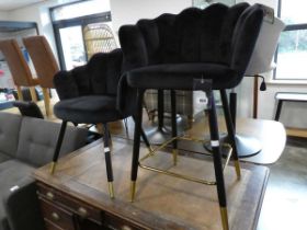 Black velvet upholstered shell shaped dining chair on black and brass coloured support, together