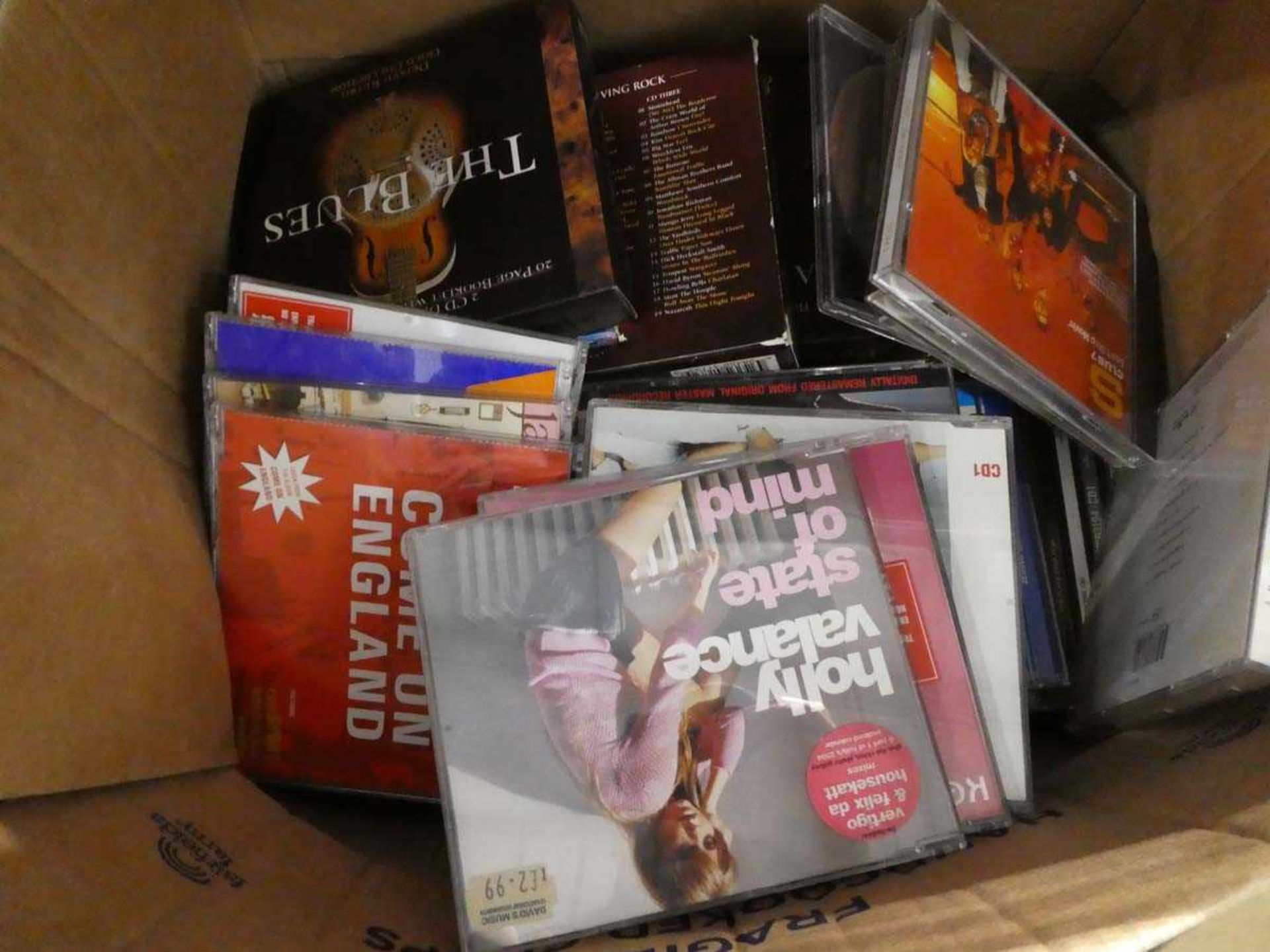 1 tray and 1 cardboard box of various music CD's