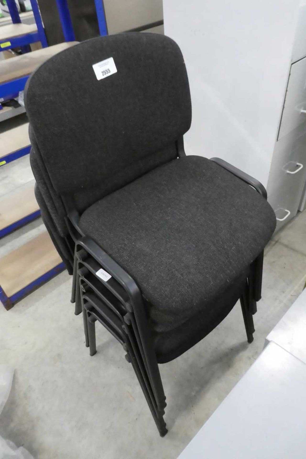 Set of 5 black fabric stacking chairs
