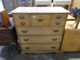 Hardwood chest with 3 long drawers, upper deep central drawer flanked by 4 smaller drawers and