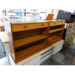 Pair of teak single drawer open fronted shelving units, low level