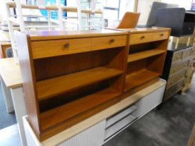 Pair of teak single drawer open fronted shelving units, low level