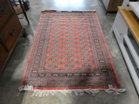 Pink ground figured and bordered rug