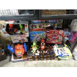 Undercage of various toys including Mario, Spiderman and Marvel