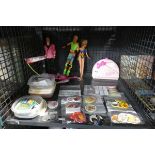 Cage containing Ken and Barbie related items together with number of badges including Diana and