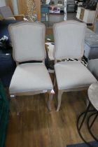 Modern pair of wooden framed natural upholstered dining chairs