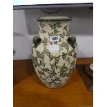 Green and beige floral pattern vase
