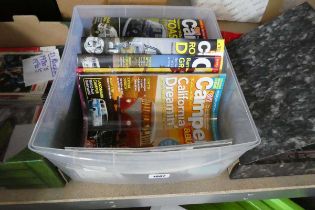 Plastic crate containing camper bus magazines