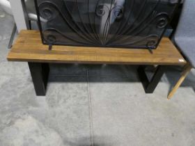 Hardwood topped low bench on U-shaped black metal supports