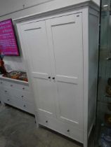 Modern white bedroom suite comprising double door wardrobe, lowboy and matching chest of 2 over 3