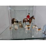 Quantity of various ornaments including Beswick hounds, horse and rider, Beswick cat, 2 pieces of