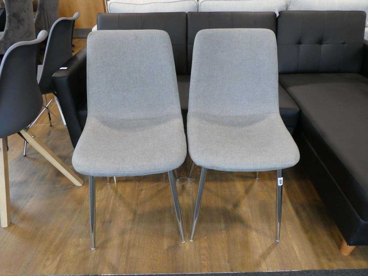 Modern pair of grey dining chairs on chrome supports