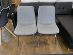 Modern pair of grey dining chairs on chrome supports