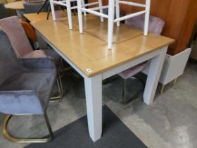 Light grey extending dining table with wood effect surface