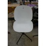 White plastic swivel office armchair on chrome 4 star base