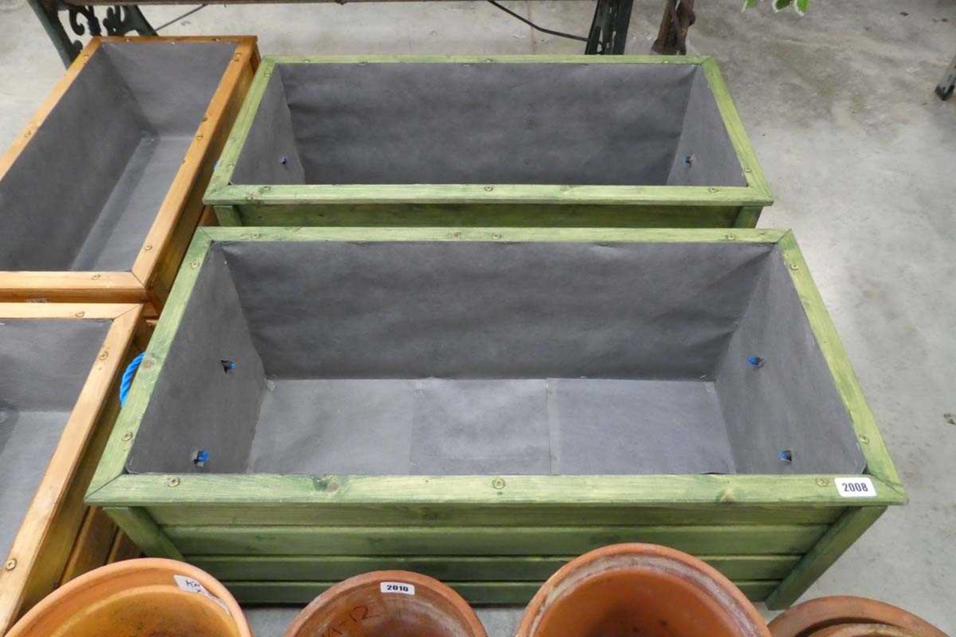 Pair of large green wooden planters