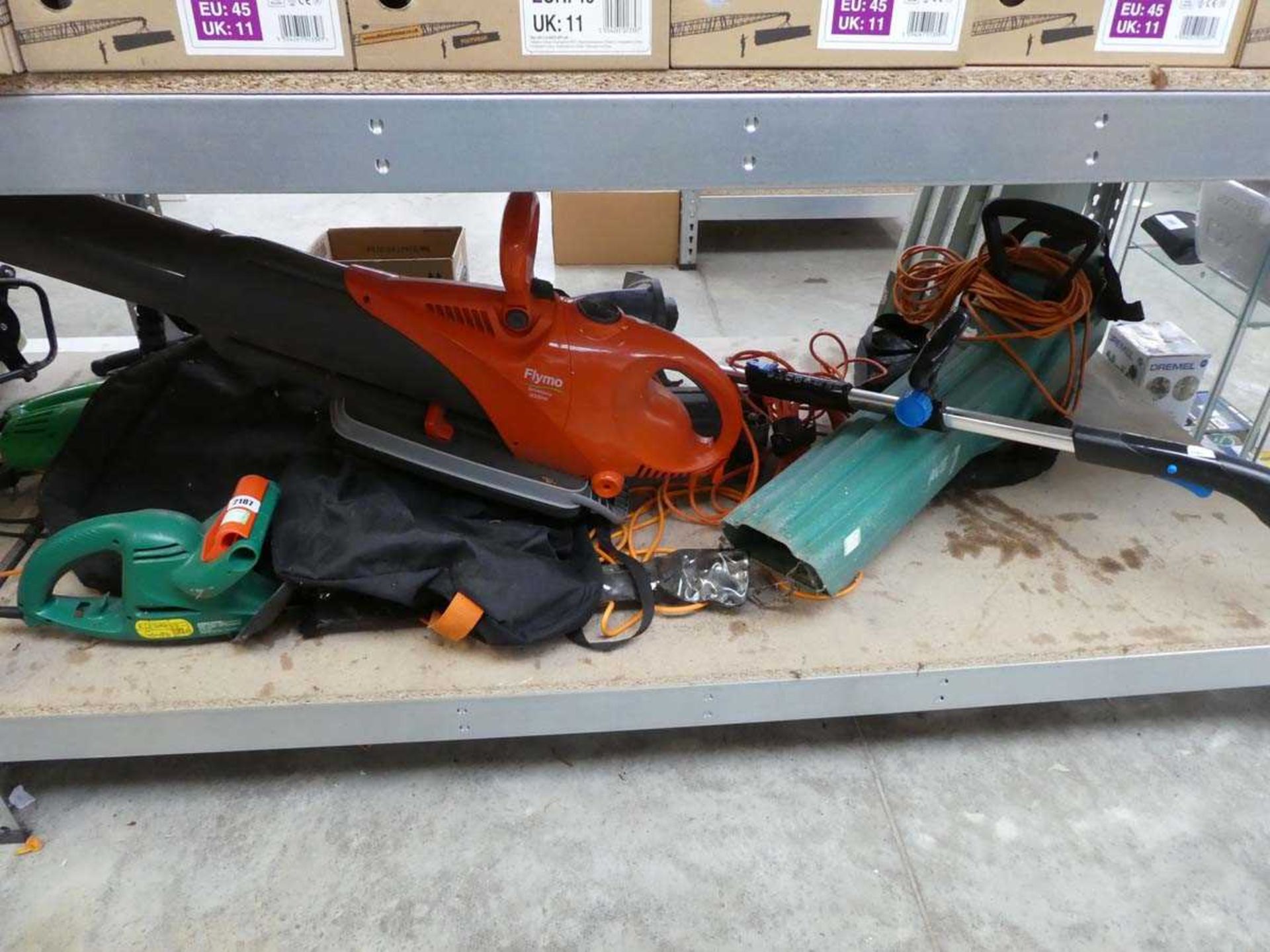 Qty of outdoor garden electric tools to include 2 leaf blowers, 2 strimmers and hedge cutter